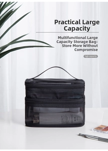 Detail of black double-layer mesh makeup bag showing handle and large storage capacity