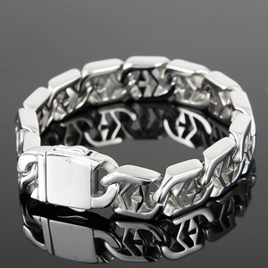 Polished silver punk cross chain bracelet with reflective mirror finish on dark background