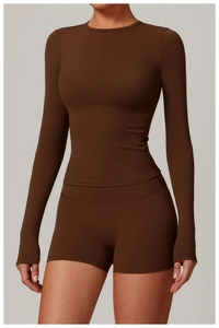 Close-up of high-stretch brushed fabric texture on brown long-sleeve yoga top