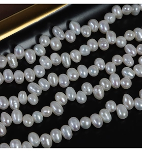 Macro detail of high-luster 4-5mm irregular white freshwater pearls for DIY jewelry making