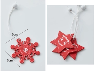 Close-up of 5cm red wooden Christmas ornaments with snowflake and reindeer patterns