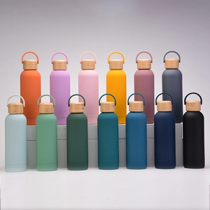 Variety of colorful matte insulated stainless steel water bottles with bamboo lids