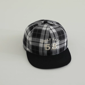 Close-up of Lucky 58 embroidery on vintage black and white checkered kids flat bill cap