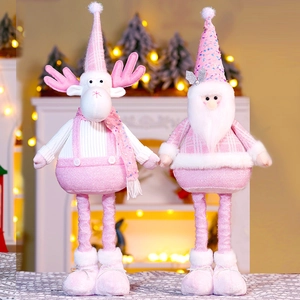 Detail of pink and white plush Christmas dolls with soft textures in festive setting