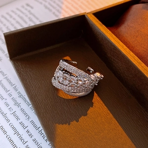 Macro shot of silver hollow multi-layer open ring with marquise and round zircon insets