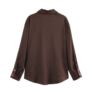 Rear view of brown long sleeve shirt showing smooth satin silk texture and drape