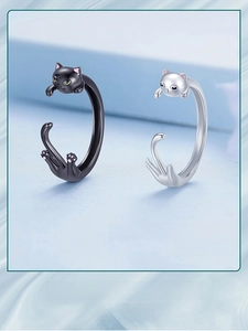 Detail of cat open rings in black matte and silver finish with pink paw prints