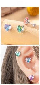 Macro shot of 8mm heart-shaped zircon studs with multi-color gradient screw backings