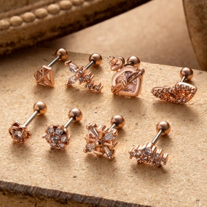 Set of 8 rose gold stainless steel cartilage earrings with zircon butterfly and flower designs