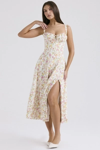 Detail of floral midi dress featuring a slim bodice and elegant side high slit design