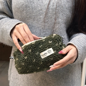 Winter plush heart pencil case in dark green lamb wool with minimalist label
