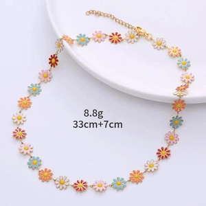 Detail of colorful enamel daisy necklace with adjustable gold chain and 33cm length