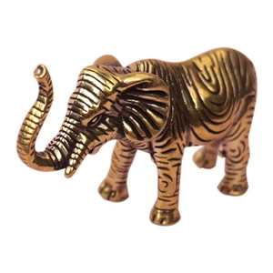 Détail de figurine d'éléphant en laiton montrant les textures en spirale ciselées