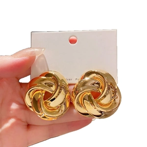 Elegant gold twisted knot earrings with polished metallic finish and 925 silver posts