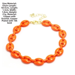 Close-up of bright orange coffee bean link chain bracelet with copper gold plating