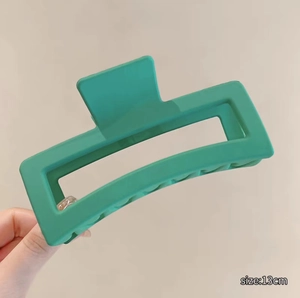 Detail view of a 13cm matte green square hair claw clip with size dimension label