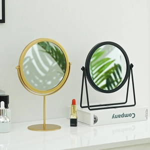 Specchi da trucco minimalisti in ferro con cornici circolari e supporti rotanti regolabili