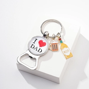 Close-up of metal bottle opener keychain with I Love Dad design and beer mug charms