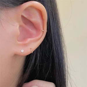 Minimalist 925 silver gold plated hoop earrings and stud set worn by model