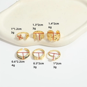 Set of six vintage gold-plated open rings with geometric, wing, and moon designs