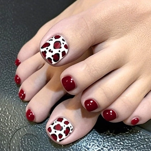 Burgundy and leopard print press-on toe nails for women with glossy finish on dark base