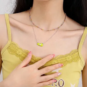Double-layered silver necklace with yellow enamel heart pendant and colorful beads