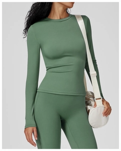 Slim fit brushed long sleeve yoga top and high waist leggings in dark green fabric