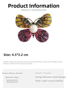 Detail view of butterfly brooch with size 4.5x3.2cm, rhinestones, and white pearl inlay