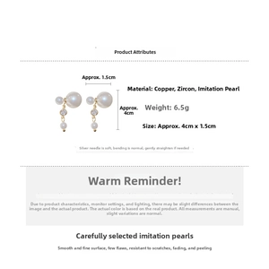 Close-up of double-sided pearl earrings with gold plating and cubic zirconia details
