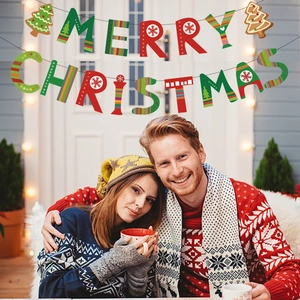 Close-up of Merry Christmas banner with red and green patterns in a festive setting
