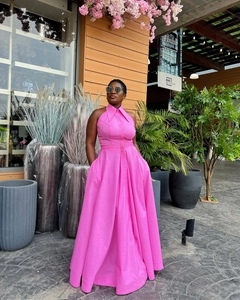 Detail of rose pink halter neck maxi dress featuring lapel collar and button-up front