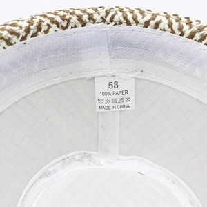 Detail view of the woven paper fiber interior and comfort sweatband of the fedora hat