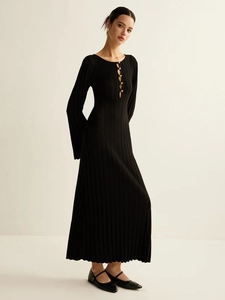 Slim fit black ribbed knit dress with V-neck, cutout detail, and golden buttons