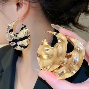 Golden wavy liquid metal texture oversized geometric drop earrings for women