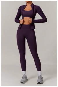Three-piece seamless dark purple yoga set with zipper jacket and high-waist leggings