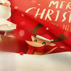 Detailed close-up of high-definition Merry Christmas print on soft red festive fabric