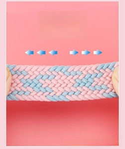 Close-up of pink and blue woven elastic belt showing stretchable fabric texture