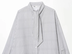 Close-up of vertical gray stripe poplin shirt with decorative neck tie detail