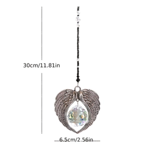 Detailed view of crystal suncatcher with metal angel wings and dimensions labeled