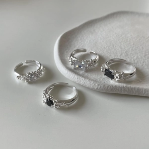 Detail of silver bubble texture rings with black and clear cubic zirconia stones