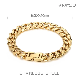 Detail of 10mm gold stainless steel curb chain bracelet with lobster clasp on white background