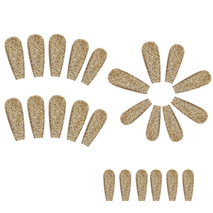 Detailed view of 24 pieces glitter gold long ballerina press-on nails set