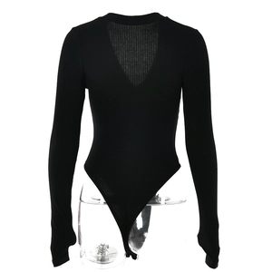 Macro shot of black ribbed knit long sleeve bodysuit showing deep back cutout and texture
