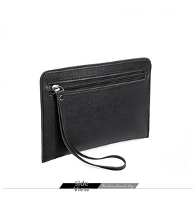 Side view of black faux leather clutch with wrist strap and zipper compartment detail
