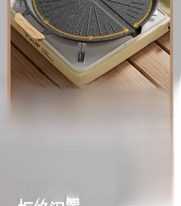 Detail of round maifan stone grill pan with oil-guide grooves and wood handles