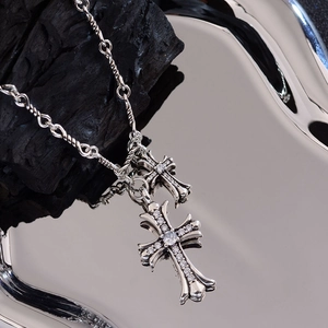 Hip hop silver double cross pendant necklace with white zircons on dark charcoal background