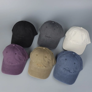 Collection of washed cotton baseball caps in six colors with subtle oval embroidery