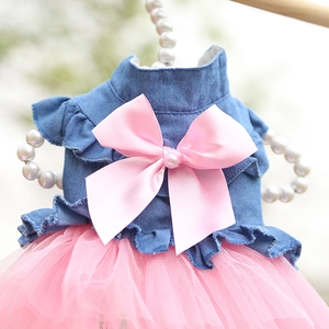 Detail of pet dress with blue denim top, pink bow, and multilayered mesh tutu skirt