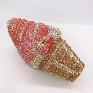 Close-up of pink and gold crystal encrusted ice cream cone shaped clutch evening bag