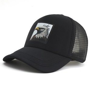 Black mesh trucker hat featuring a bald eagle patch and breathable outdoor design